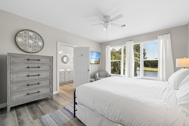 8512 Turnberry Ct Unit 8512, Miramar Beach, FL 32550 - bedroom with light wood-style flooring, vaulted ceiling, ensuite bath, ceiling fan, and baseboards
