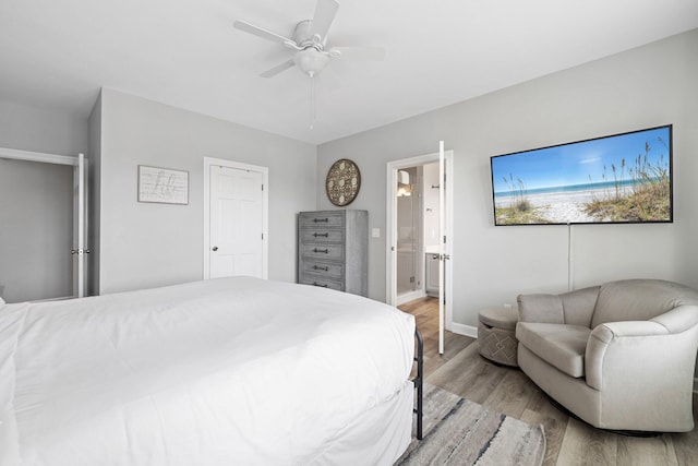 8512 Turnberry Ct Unit 8512, Miramar Beach, FL 32550 - bedroom featuring light wood finished floors, baseboards, ensuite bath, and a ceiling fan