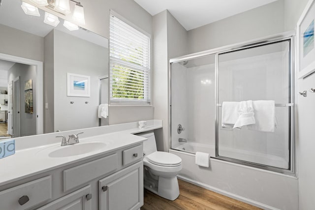 8512 Turnberry Ct Unit 8512, Miramar Beach, FL 32550 - full bath featuring vanity, wood finished floors, shower / bath combination with glass door, and toilet
