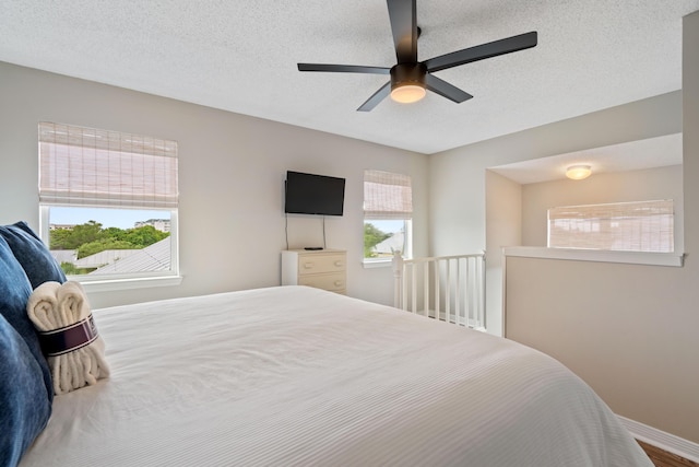 4508 Luke Ave, Destin, FL 32541 - bedroom featuring a textured ceiling, ceiling fan, and baseboards