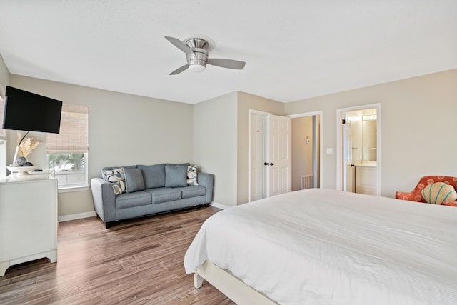 4508 Luke Ave, Destin, FL 32541 - bedroom with baseboards, wood finished floors, ceiling fan, and ensuite bathroom