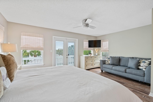 4508 Luke Ave, Destin, FL 32541 - bedroom with access to outside, wood finished floors, ceiling fan, and a textured ceiling