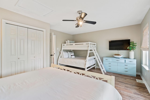 4508 Luke Ave, Destin, FL 32541 - bedroom with wood finished floors, a closet, baseboards, ceiling fan, and attic access