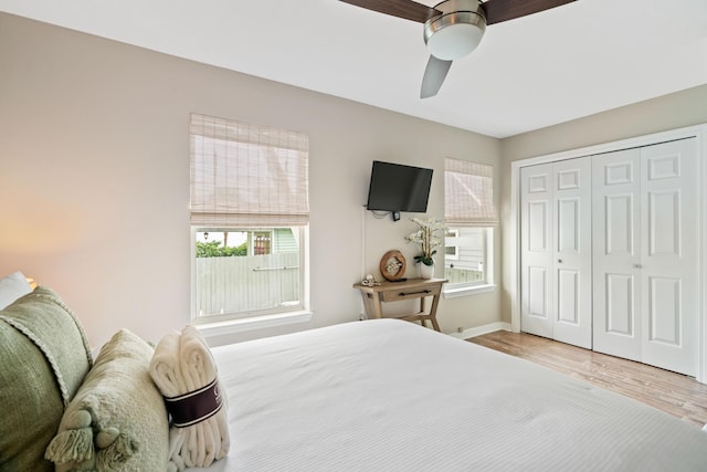 4508 Luke Ave, Destin, FL 32541 - bedroom with wood finished floors, a closet, baseboards, and a ceiling fan