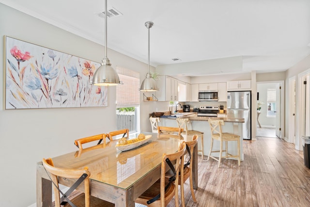 4508 Luke Ave, Destin, FL 32541 - dining room featuring light wood-style flooring and baseboards