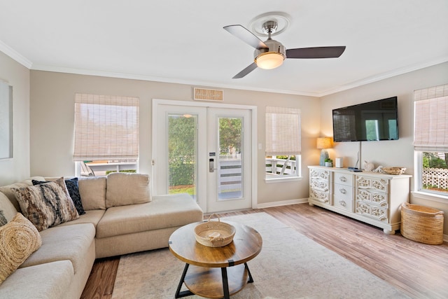4508 Luke Ave, Destin, FL 32541 - living room with ornamental molding, wood finished floors, a ceiling fan, and baseboards