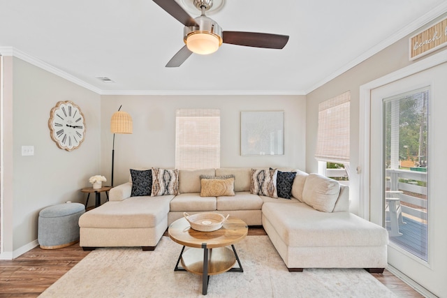 4508 Luke Ave, Destin, FL 32541 - living area with wood finished floors, ornamental molding, baseboards, and a ceiling fan
