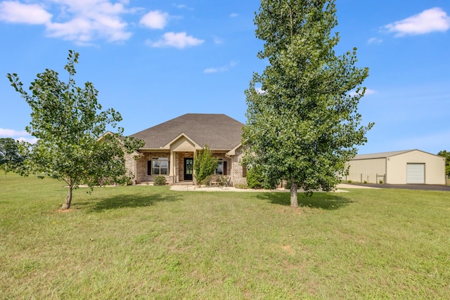 1725 Vinson Ray Rd, Baker, FL 32531 - view of front of property with a garage, a front lawn, brick siding, and an outdoor structure