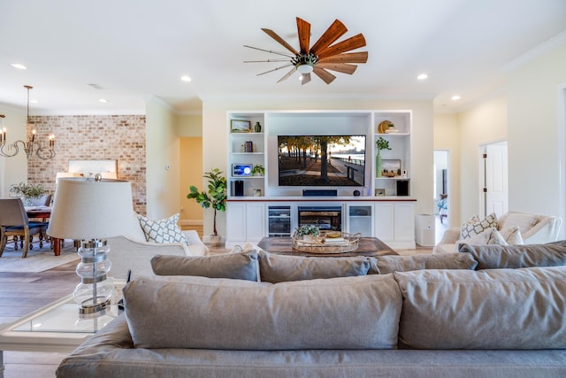 1725 Vinson Ray Rd, Baker, FL 32531 - living area featuring crown molding, a chandelier, beverage cooler, a fireplace, and recessed lighting