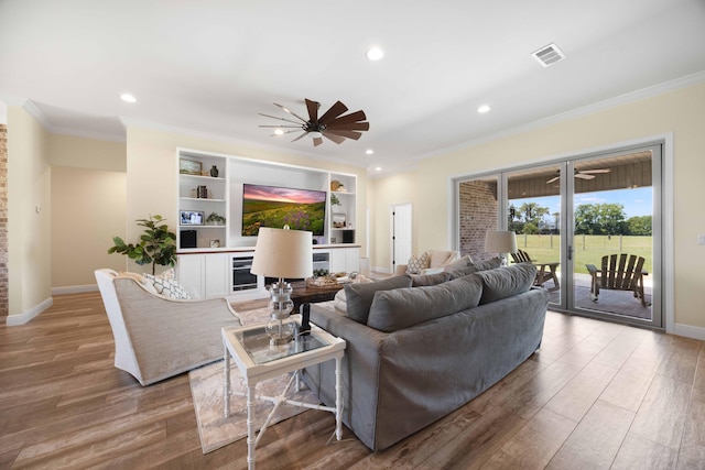 1725 Vinson Ray Rd, Baker, FL 32531 - living area with ornamental molding, wood finished floors, baseboards, recessed lighting, and ceiling fan