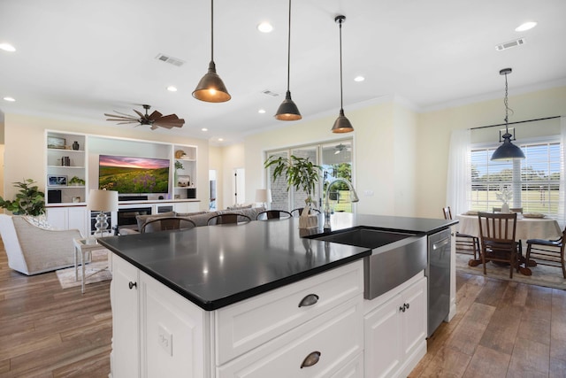 1725 Vinson Ray Rd, Baker, FL 32531 - kitchen with a sink, dishwasher, dark countertops, dark wood finished floors, and ornamental molding