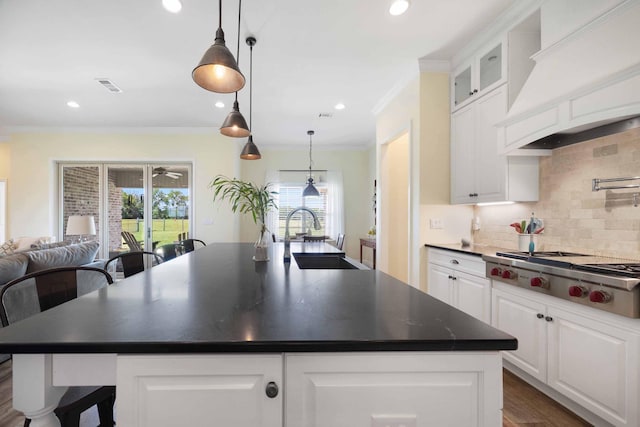 1725 Vinson Ray Rd, Baker, FL 32531 - kitchen with a sink, stainless steel gas cooktop, premium range hood, dark countertops, and ornamental molding
