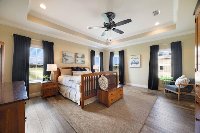 1725 Vinson Ray Rd, Baker, FL 32531 - bedroom featuring a tray ceiling, crown molding, light wood-style flooring, baseboards, and recessed lighting