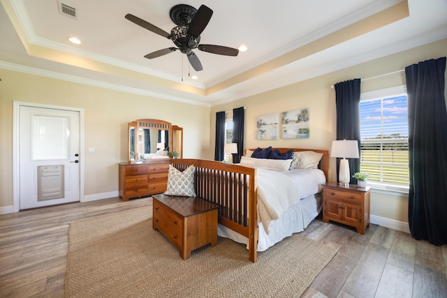1725 Vinson Ray Rd, Baker, FL 32531 - bedroom featuring a raised ceiling, crown molding, light wood-style floors, baseboards, and recessed lighting