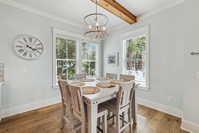 60 Barefoot Ln, Inlet Beach, FL 32461 - dining space with beam ceiling, wood-type flooring, a chandelier, and baseboards