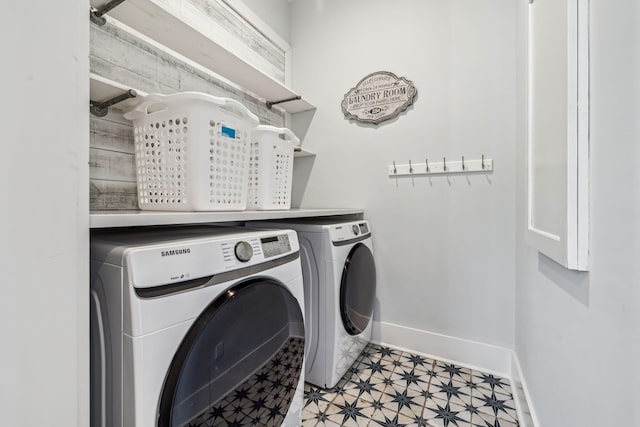 60 Barefoot Ln, Inlet Beach, FL 32461 - laundry area featuring washing machine and dryer, baseboards, and light flooring