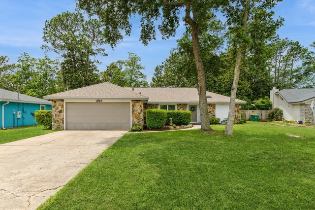1148 Pin Oak Cir, Niceville, FL 32578 - view of front of property featuring stone siding, a garage, driveway, and roof with shingles