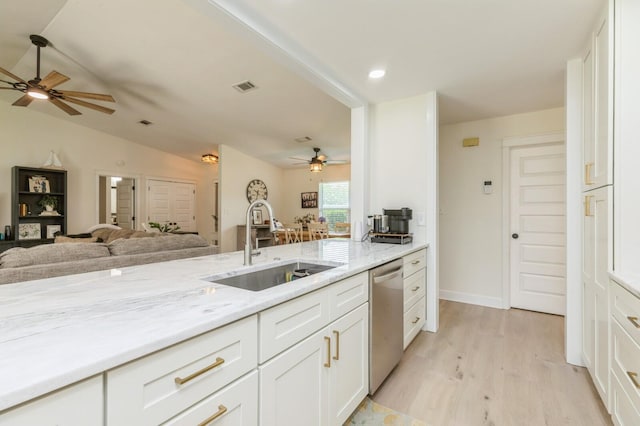 1148 Pin Oak Cir, Niceville, FL 32578 - kitchen with a ceiling fan, dishwasher, a sink, white cabinetry, and lofted ceiling