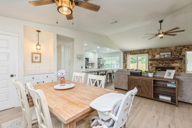 1148 Pin Oak Cir, Niceville, FL 32578 - dining area with ceiling fan, light wood finished floors, and vaulted ceiling