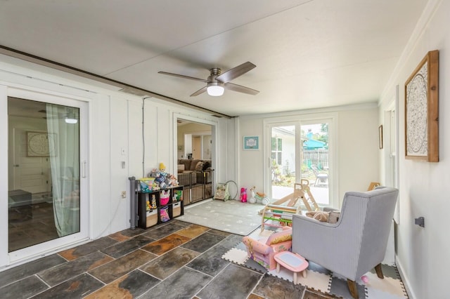 1148 Pin Oak Cir, Niceville, FL 32578 - living room with ceiling fan and dark stone finish flooring