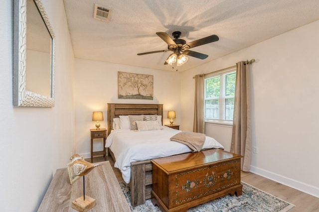 1148 Pin Oak Cir, Niceville, FL 32578 - bedroom featuring wood finished floors, baseboards, and a ceiling fan