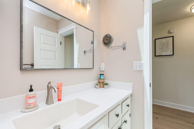 1148 Pin Oak Cir, Niceville, FL 32578 - bathroom with vanity, wood finished floors, and baseboards