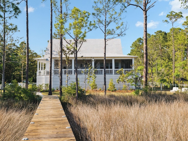 241 N 7th St, Santa Rosa Beach, FL 32459 - rear view of house featuring a sunroom