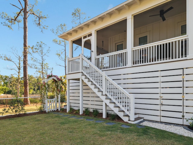 241 N 7th St, Santa Rosa Beach, FL 32459 - view of property exterior featuring stairs and a sunroom
