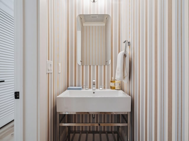241 N 7th St, Santa Rosa Beach, FL 32459 - bathroom with wallpapered walls and a sink