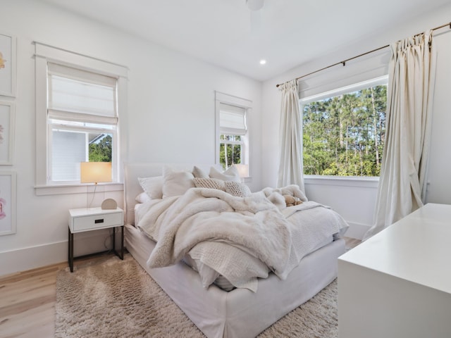 241 N 7th St, Santa Rosa Beach, FL 32459 - bedroom with light wood-style flooring, recessed lighting, and baseboards