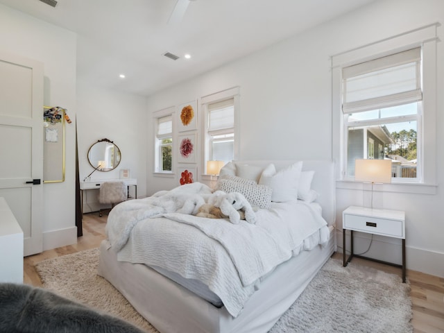 241 N 7th St, Santa Rosa Beach, FL 32459 - bedroom featuring wood finished floors, baseboards, and recessed lighting