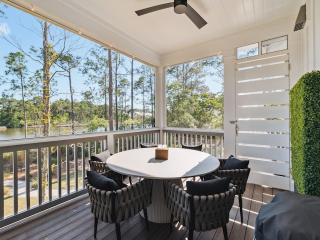 241 N 7th St, Santa Rosa Beach, FL 32459 - sunroom / solarium with a ceiling fan, outdoor dining area, a water view, and view of scattered trees