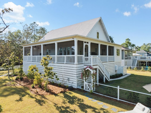 241 N 7th St, Santa Rosa Beach, FL 32459 - view of front of home featuring a sunroom, stairs, and a shingled roof