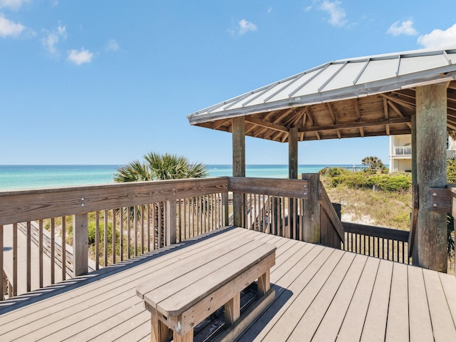 241 N 7th St, Santa Rosa Beach, FL 32459 - wooden terrace with view of water and beach and a gazebo