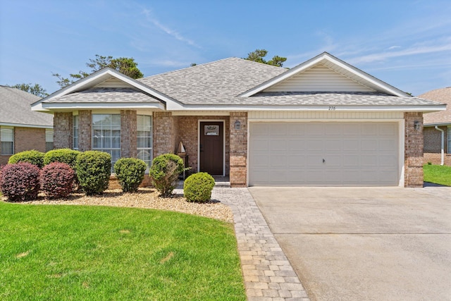 276 Sandy Cay Dr, Miramar Beach, FL 32550 - view of front facade with a shingled roof, brick siding, and concrete driveway
