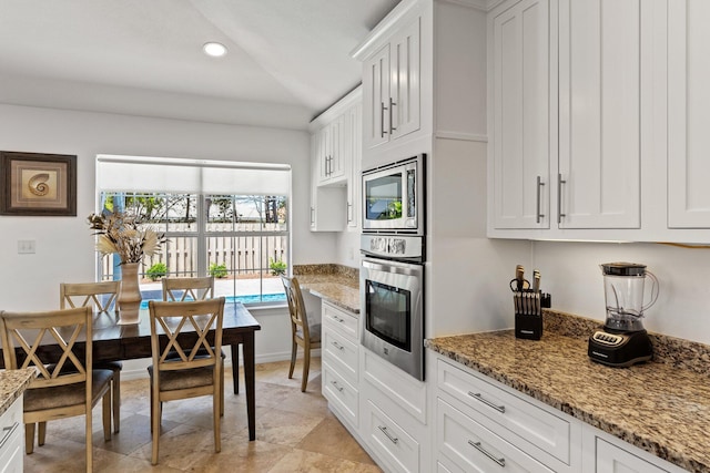 276 Sandy Cay Dr, Miramar Beach, FL 32550 - kitchen with stainless steel appliances, white cabinetry, recessed lighting, and light stone countertops