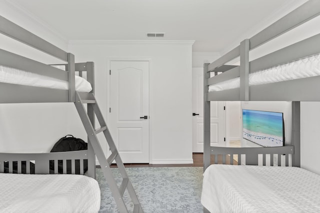 276 Sandy Cay Dr, Miramar Beach, FL 32550 - bedroom featuring crown molding, wood finished floors, and baseboards