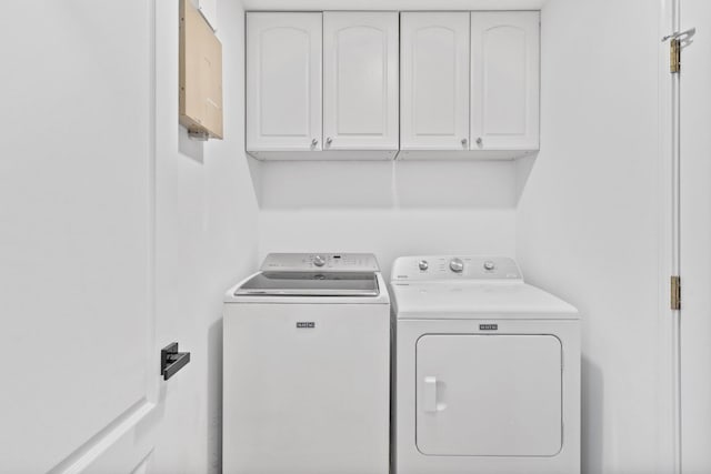 276 Sandy Cay Dr, Miramar Beach, FL 32550 - laundry room featuring washing machine and dryer and cabinet space