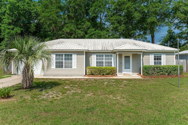 390 Brackin St, Crestview, FL 32539 - single story home featuring metal roof and concrete driveway