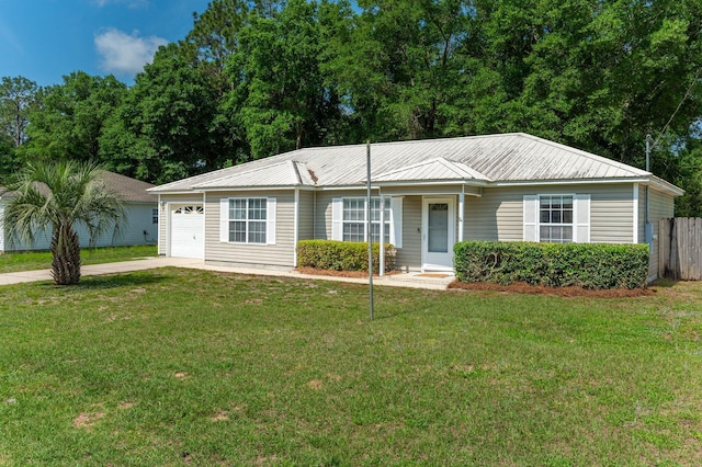390 Brackin St, Crestview, FL 32539 - single story home with concrete driveway, metal roof, and an attached garage