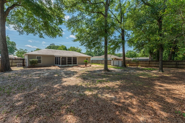 390 Brackin St, Crestview, FL 32539 - fenced backyard featuring a sunroom