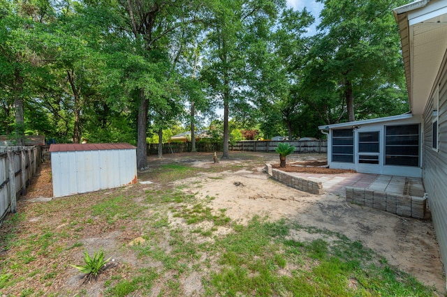 390 Brackin St, Crestview, FL 32539 - fenced backyard with a sunroom and view of scattered trees