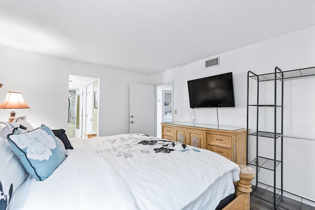11483 Front Beach Rd Unit 202, Panama City Beach, FL 32407 - bedroom featuring wood finished floors and ensuite bath
