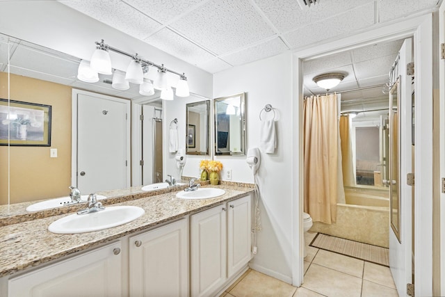11483 Front Beach Rd Unit 202, Panama City Beach, FL 32407 - bathroom with tile patterned flooring, shower / bath combo, a drop ceiling, double vanity, and toilet