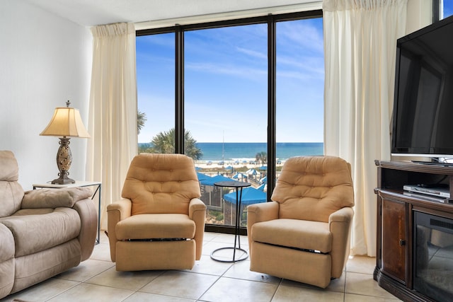 11483 Front Beach Rd Unit 202, Panama City Beach, FL 32407 - living area featuring light tile patterned floors and a wall of windows