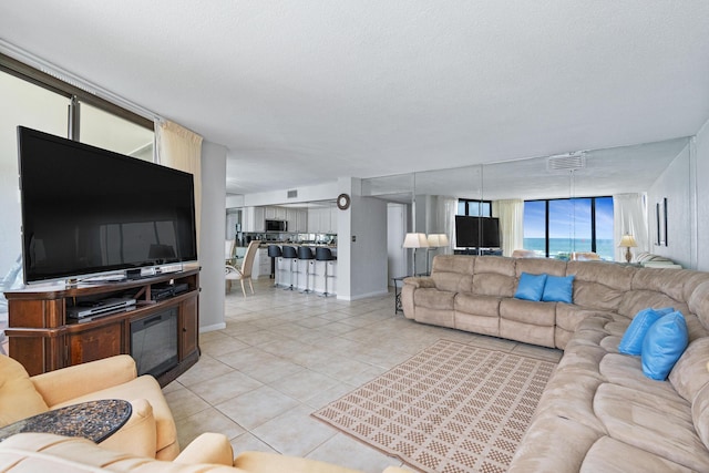 11483 Front Beach Rd Unit 202, Panama City Beach, FL 32407 - living area featuring light tile patterned floors and baseboards