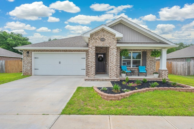 5378 Wyndell Cir, Crestview, FL 32539 - view of front of home featuring covered porch, brick siding, driveway, and an attached garage