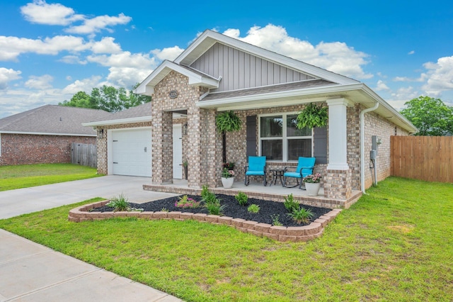5378 Wyndell Cir, Crestview, FL 32539 - view of front of home featuring a porch, board and batten siding, a garage, concrete driveway, and brick siding