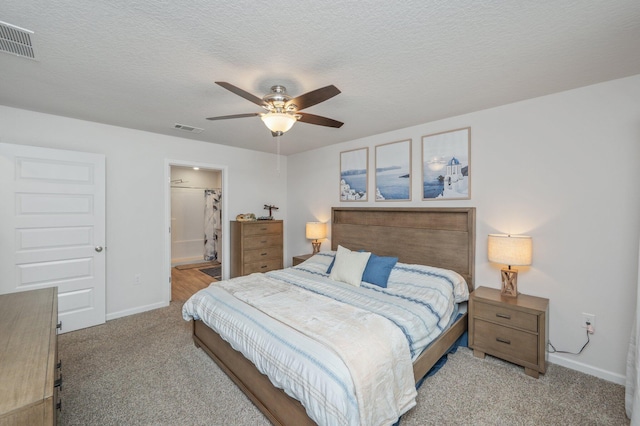5378 Wyndell Cir, Crestview, FL 32539 - bedroom featuring carpet flooring, baseboards, a ceiling fan, a textured ceiling, and ensuite bath