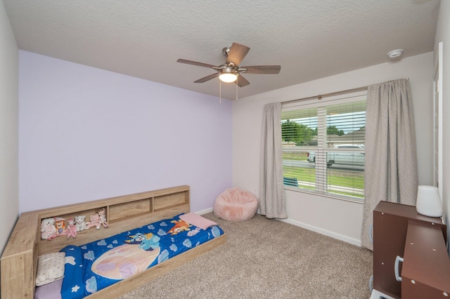 5378 Wyndell Cir, Crestview, FL 32539 - unfurnished bedroom with carpet flooring, baseboards, ceiling fan, and a textured ceiling